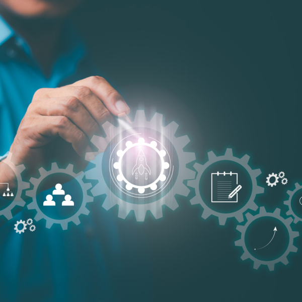 Managing and planning business processes and workflows for higher goals.Business strategy,Young businessman pointing at an icon with a pen ,Optimize business process workflow.Digital marketing.